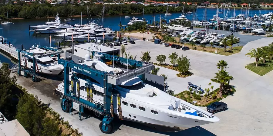 300 tonne marine travel lift carrying a superyacht and a 100 tonne marine travel lift carrying a yacht